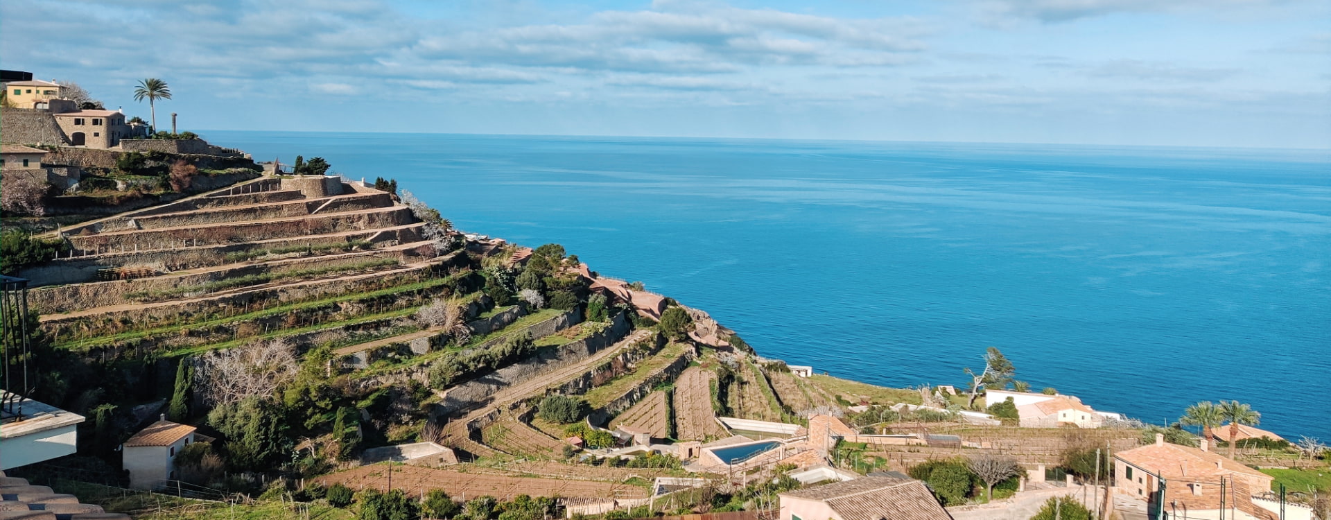 Panoramic image of Banyalbufar with the Mediterranean Sea in the background.