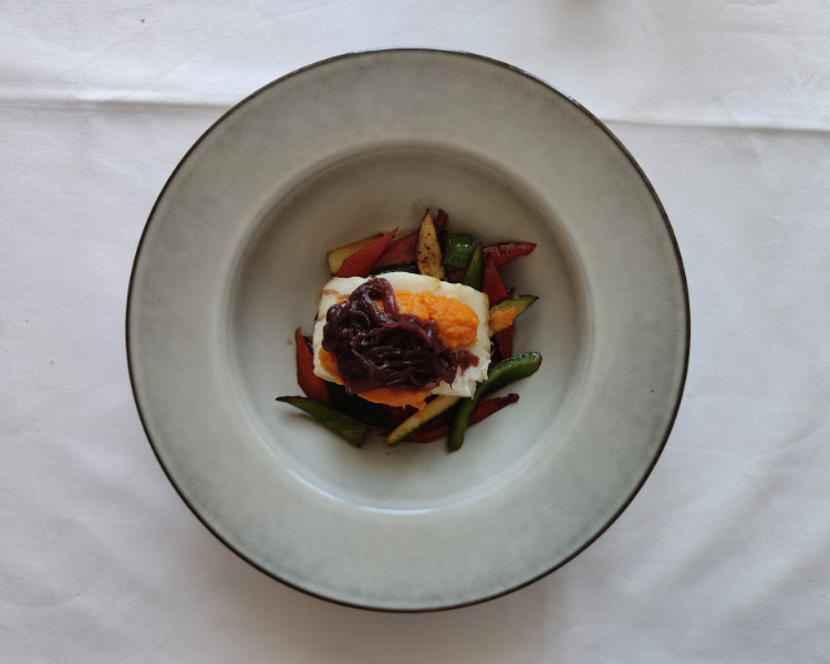 Well-decorated plate with a traditional Mallorcan cuisine dish