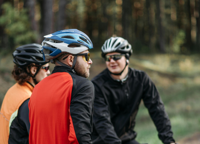 Cyclists in a group talking together on a route